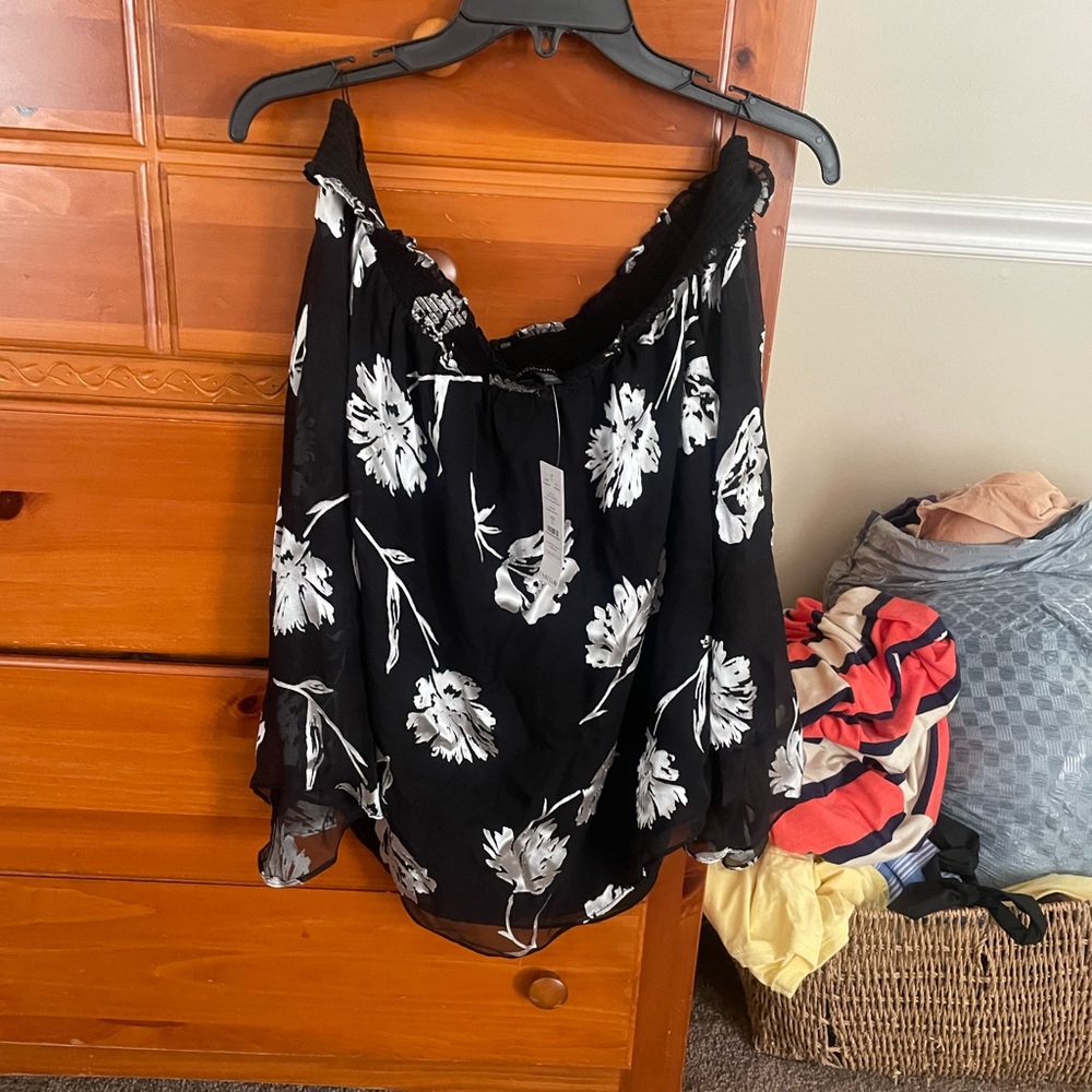 Flower off shoulder shirt.  Light material and comfortable